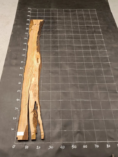 Planche en bois d'olivier rabotée 185×28 cm à bord naturel — pièce unique (P14)